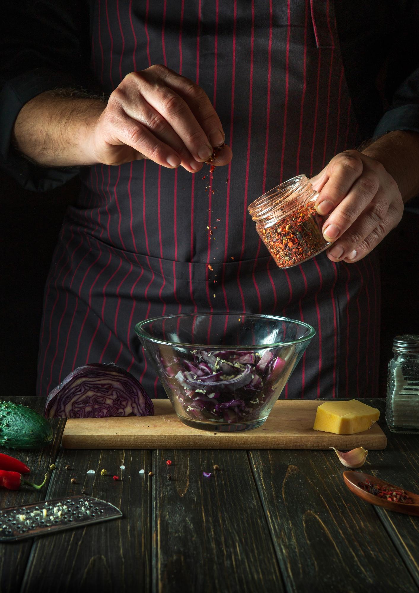 Hand mixing spices in bowl